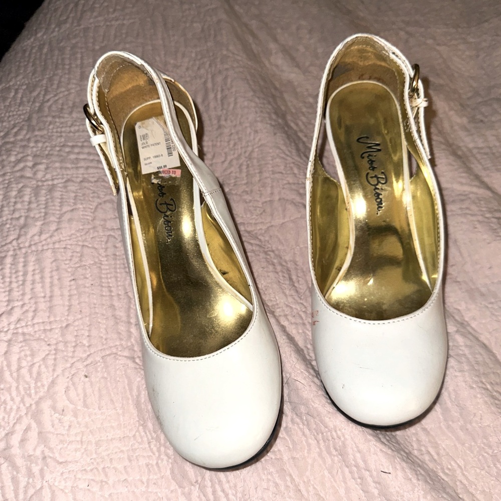Slightly worn white closed toe heels with open back